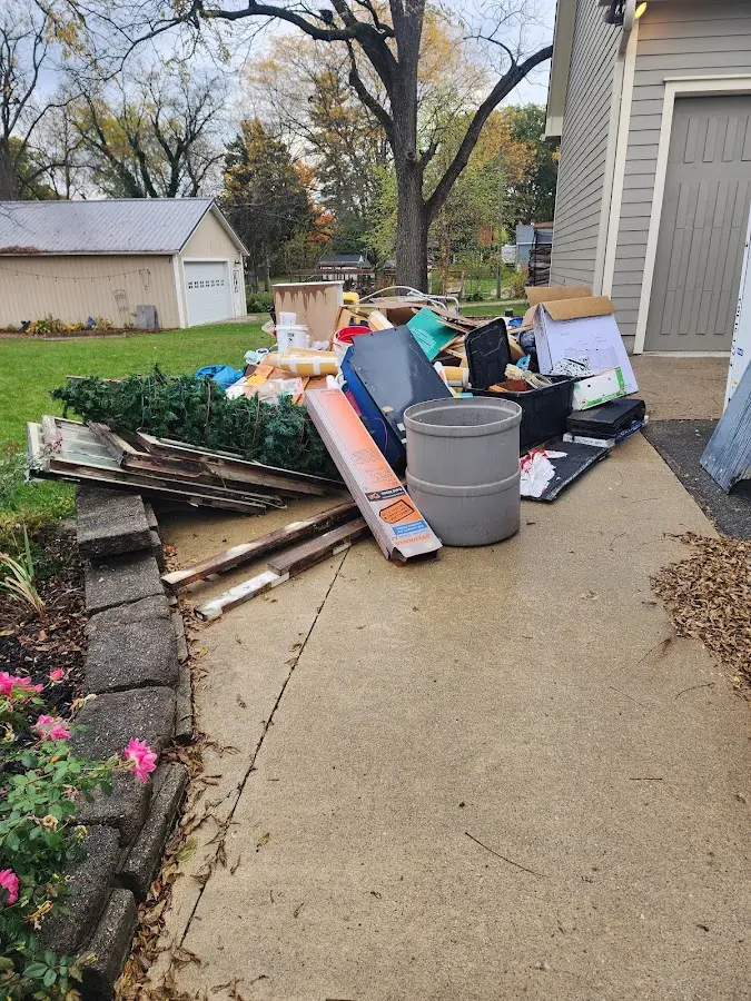 Dumpster being loaded with debris for Residential Dumpster Rental in East Windsor